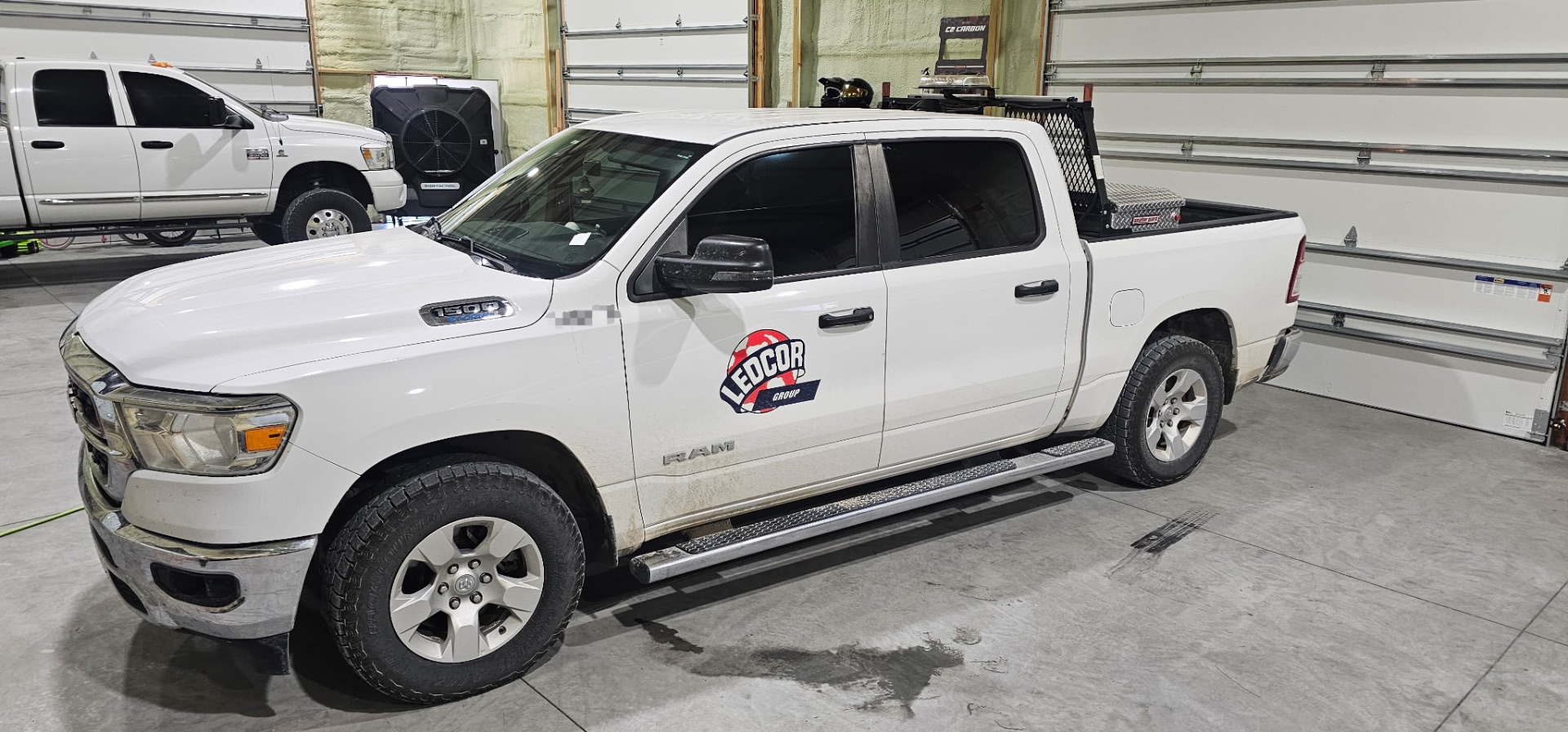 White Ram 1500 Ledcor Group work truck with fresh window tint at the Fallon shop