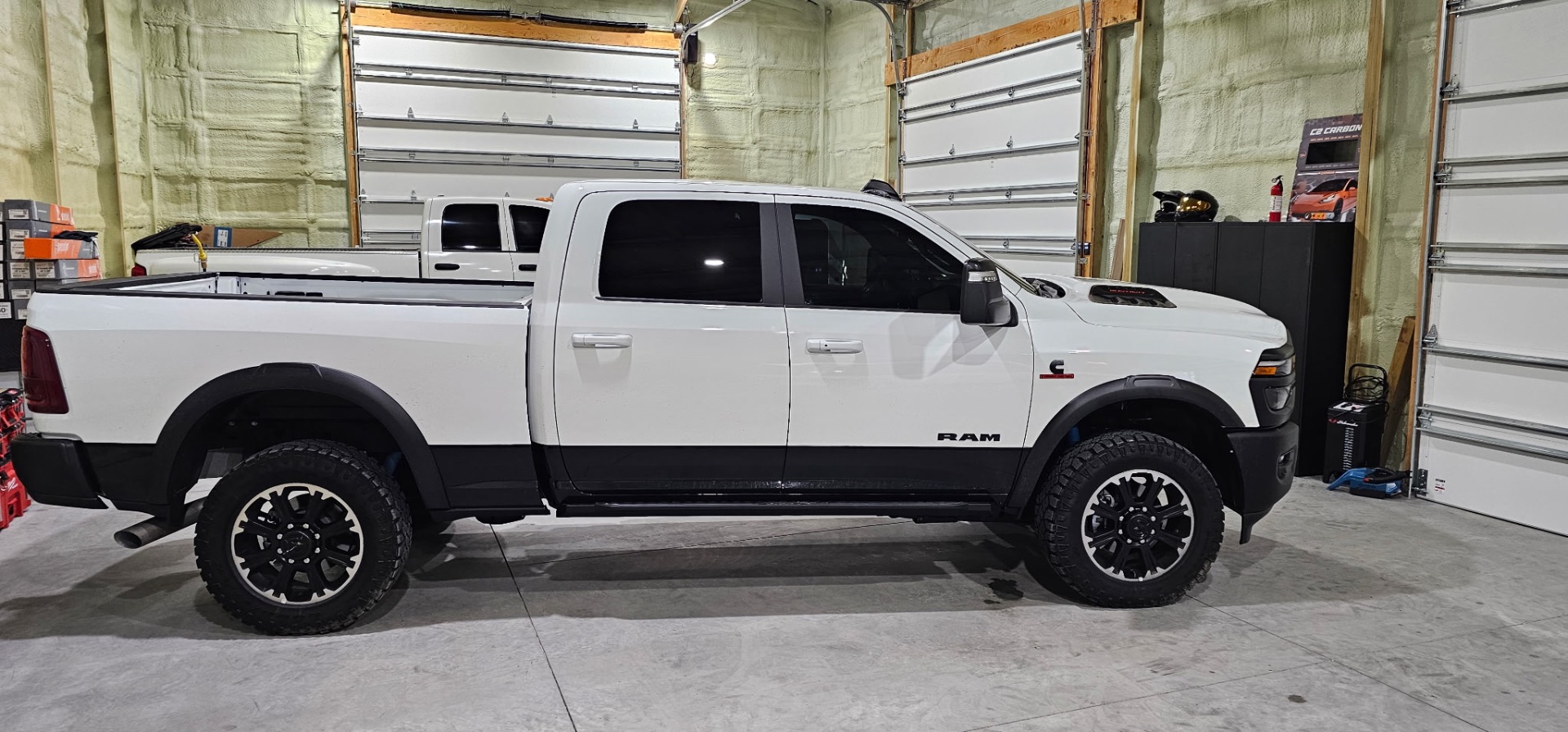 Side view of a white Ram 2500 Power Wagon with premium window tint