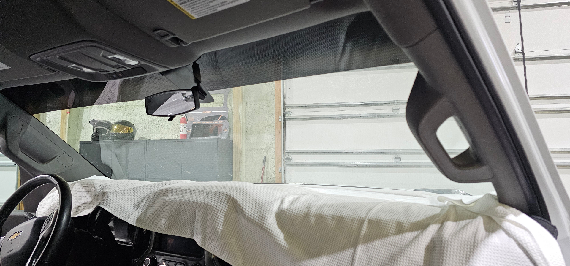 Ceramic windshield visor strip freshly installed on a Chevy Silverado