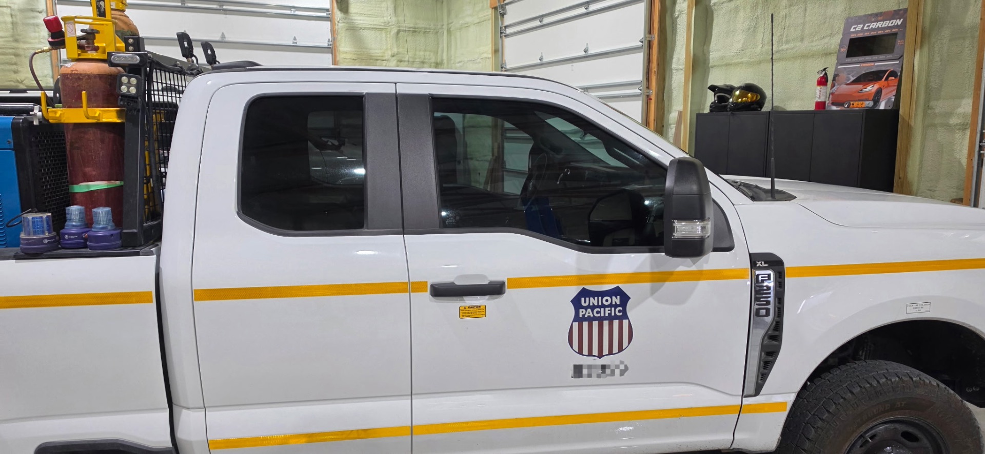Side profile of a Union Pacific Ford F-250 with premium window tint installed